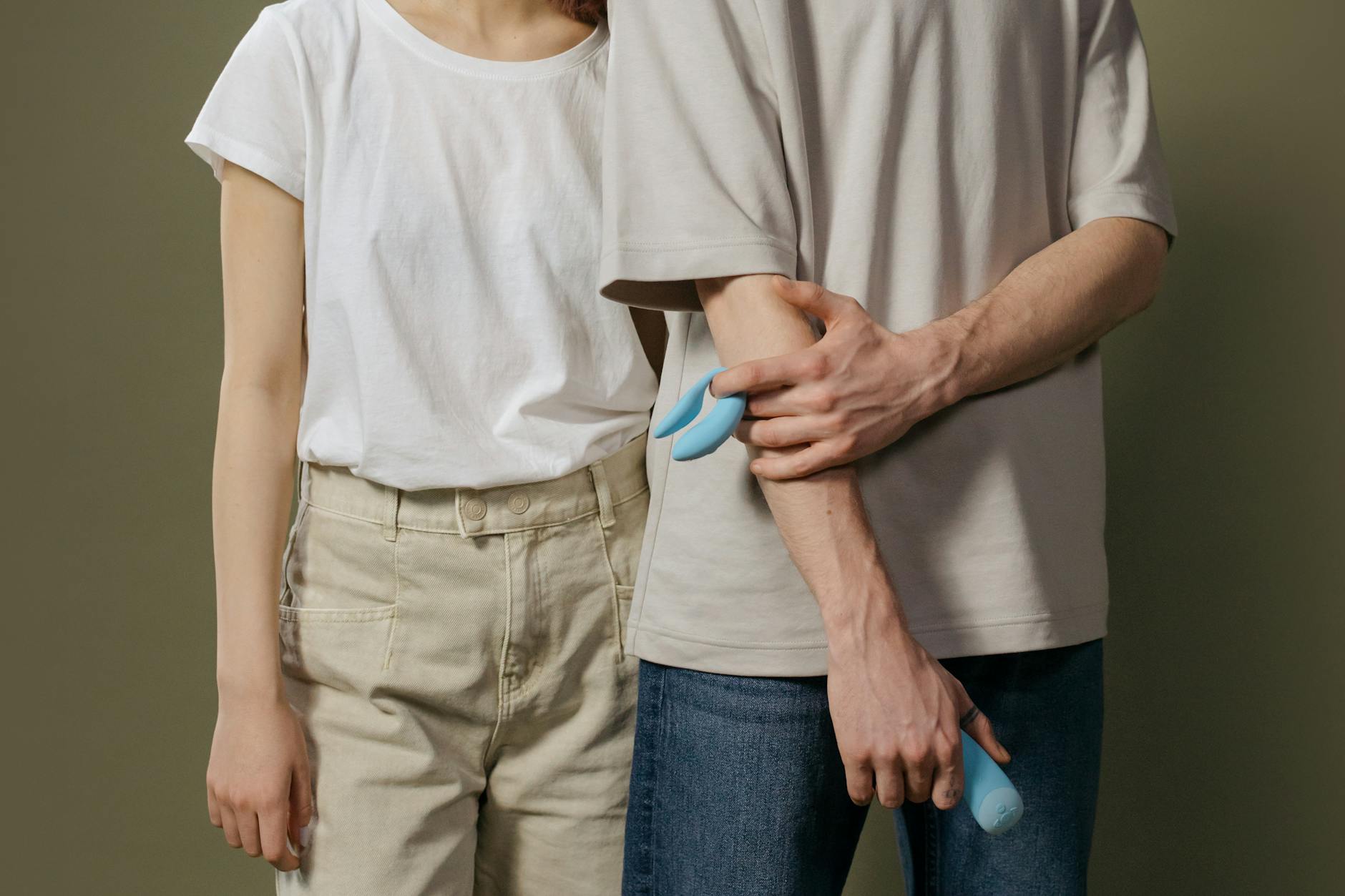 A couple standing close together indoors, representing modern intimacy and open communication about desires.